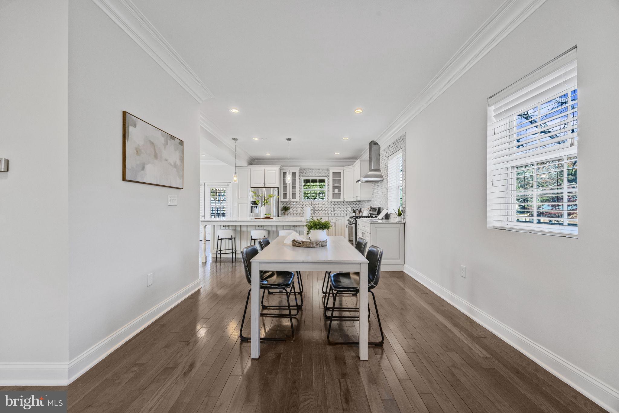 2420 West Rogers Avenue Baltimore, MD 21209 - Photo 16 of 67 a view of a dining room with furniture and wooden floor
