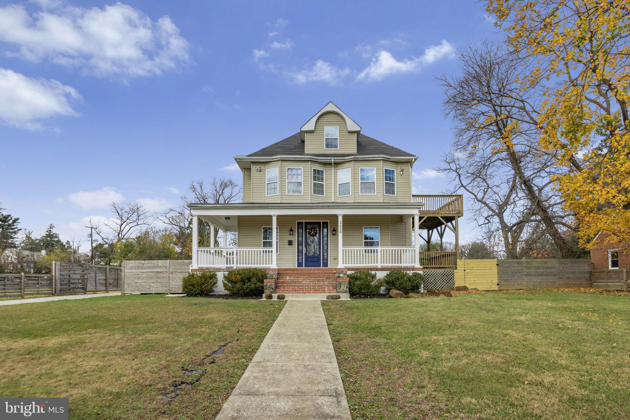 2420 West Rogers Avenue Baltimore, MD 21209 - Photo 2 of 67 a front view of a house with garden