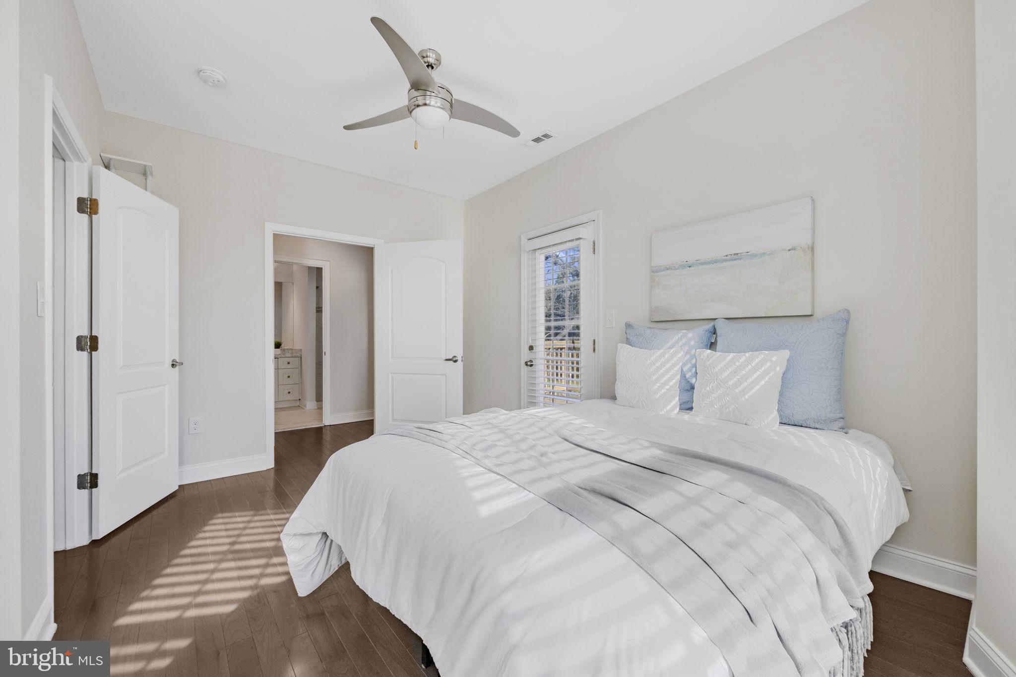 2420 West Rogers Avenue Baltimore, MD 21209 - Photo 33 of 67 a bedroom with a bed and a chandelier