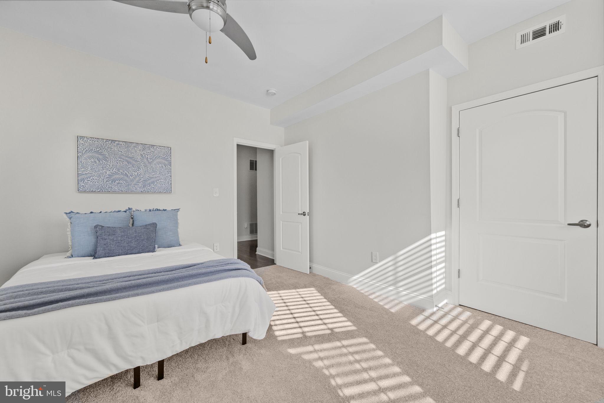 2420 West Rogers Avenue Baltimore, MD 21209 - Photo 36 of 67 a bedroom with a large bed and a window