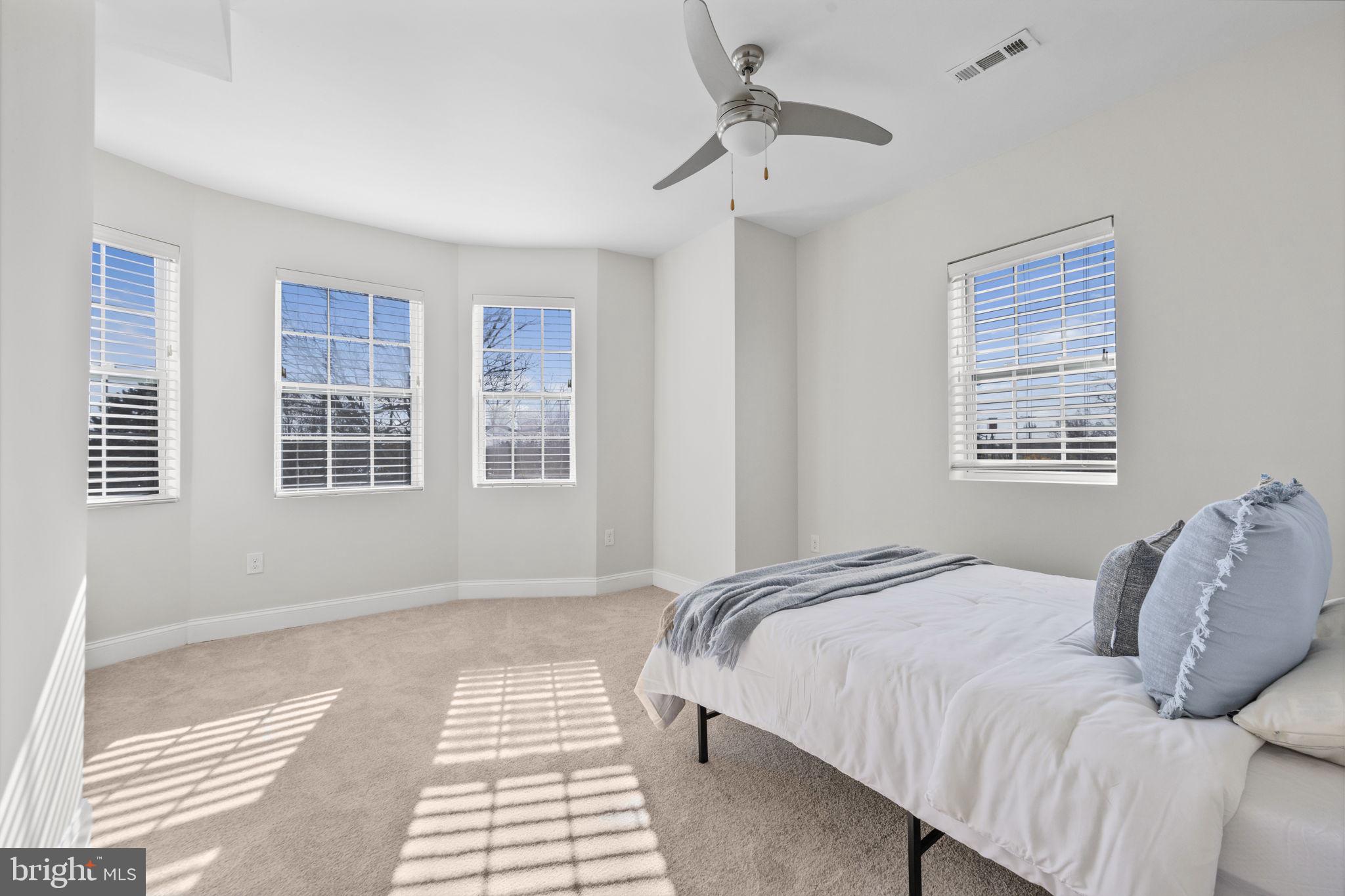 2420 West Rogers Avenue Baltimore, MD 21209 - Photo 37 of 67 a bedroom with a large bed and a window