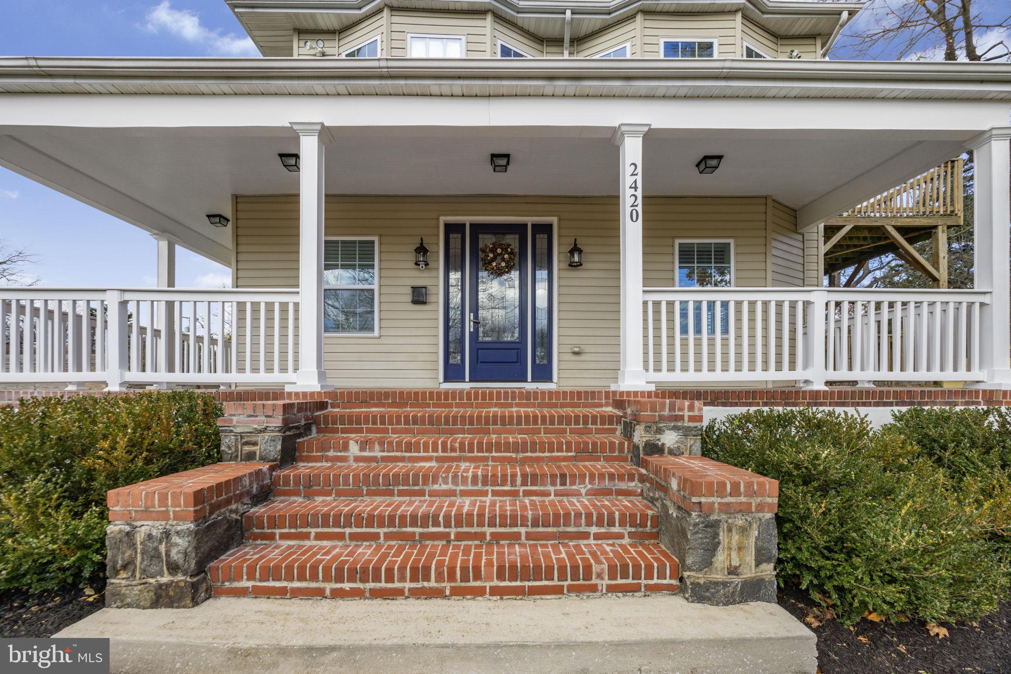 2420 West Rogers Avenue Baltimore, MD 21209 - Photo 52 of 67 a front view of a house with a garden