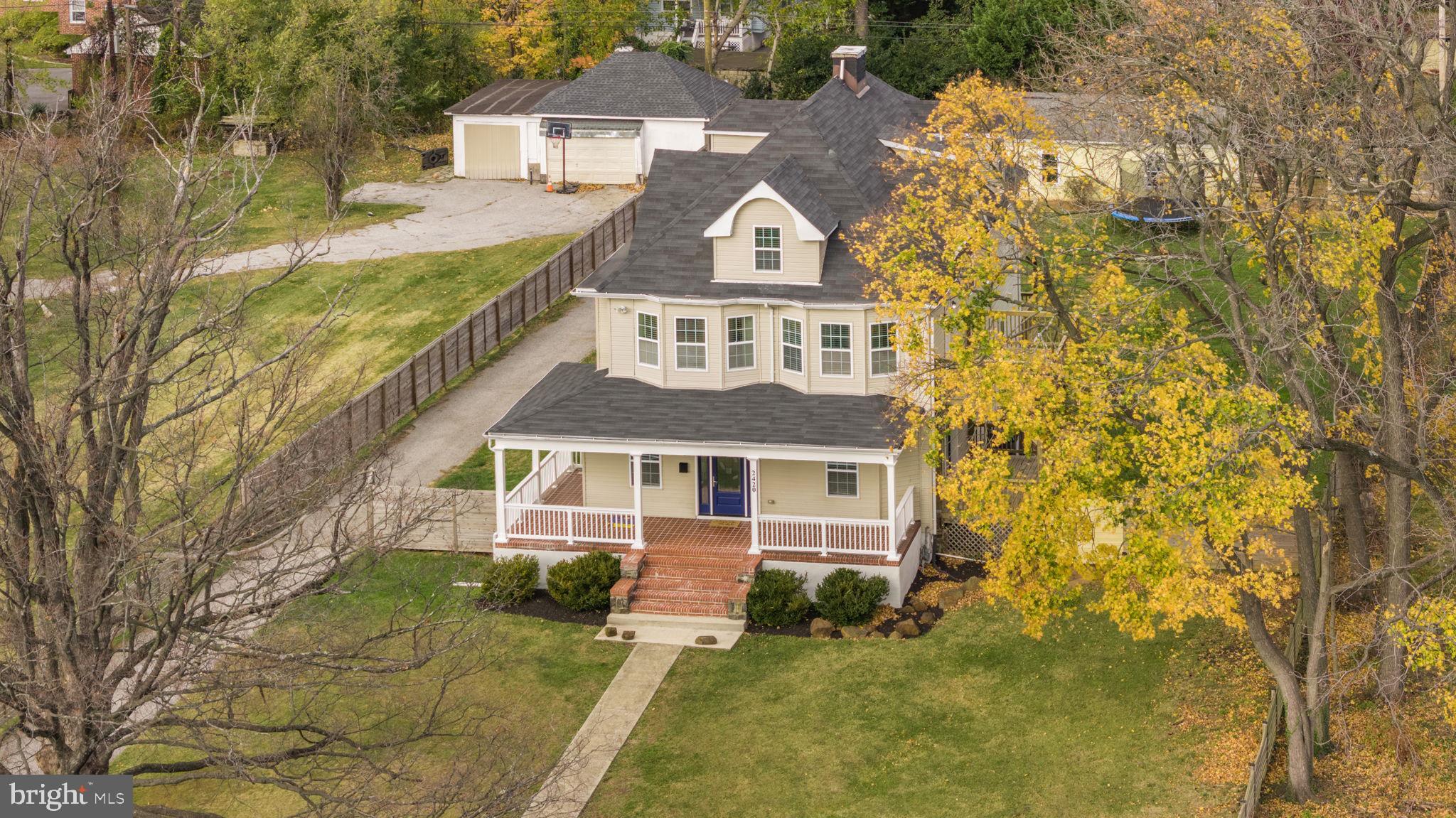 2420 West Rogers Avenue Baltimore, MD 21209 - Photo 60 of 67 front view of a house with a yard