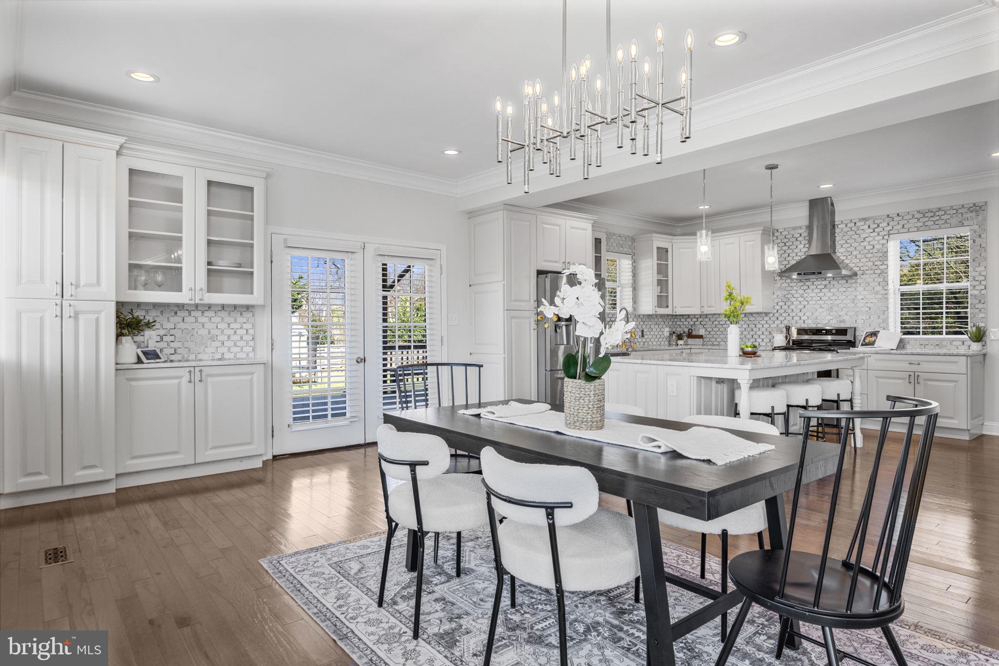 2420 West Rogers Avenue Baltimore, MD 21209 - Photo 9 of 67 a view of a dining room with furniture wooden floor and chandelier