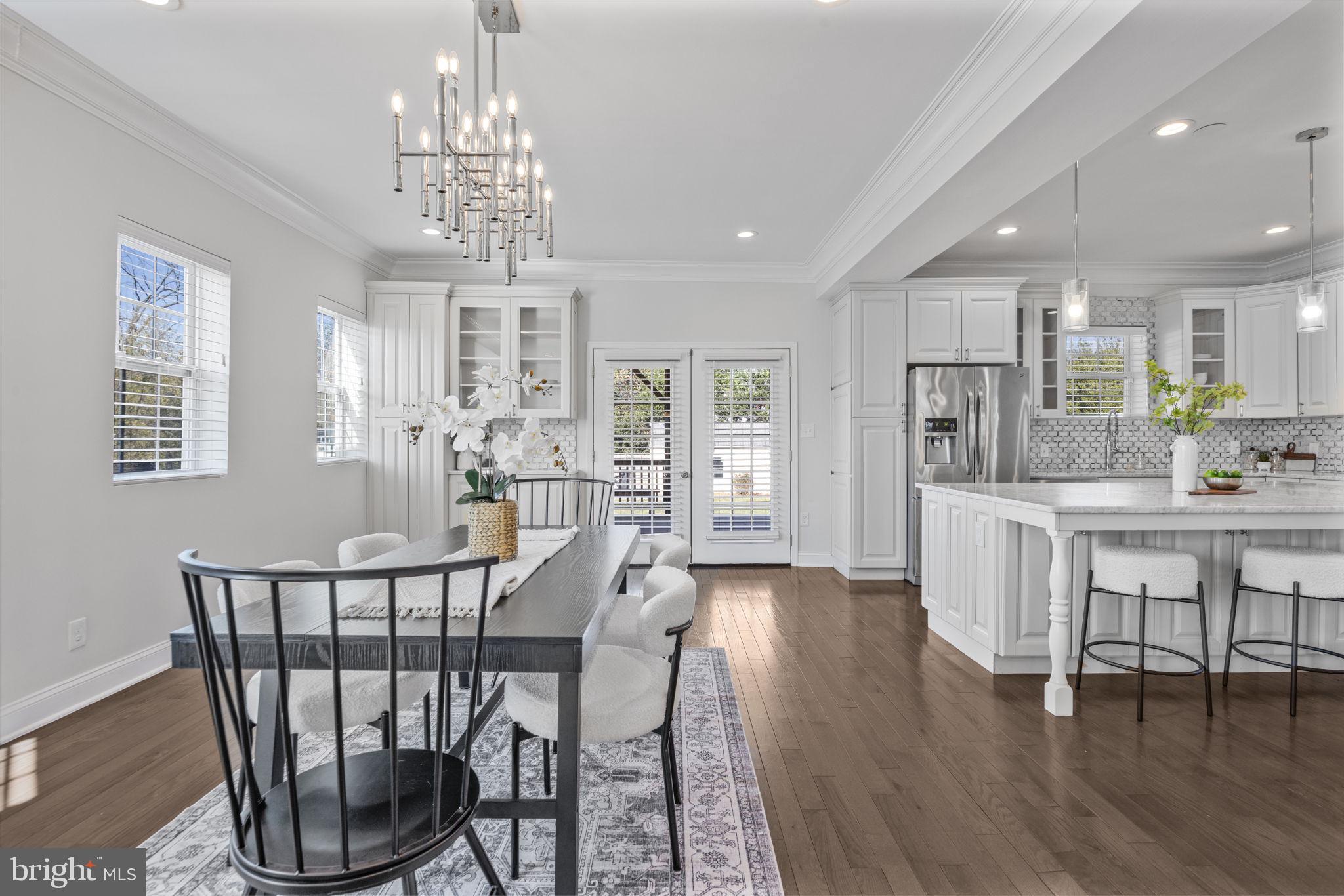 2420 West Rogers Avenue Baltimore, MD 21209 - Photo 10 of 67 a view of a dining room with furniture window and wooden floor