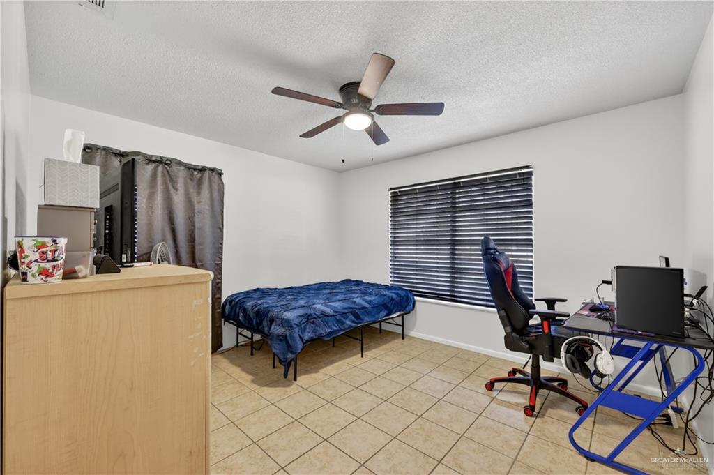 616 5th Street Weslaco, TX 78596 - Photo 32 of 33 a livingroom with workspace and a window