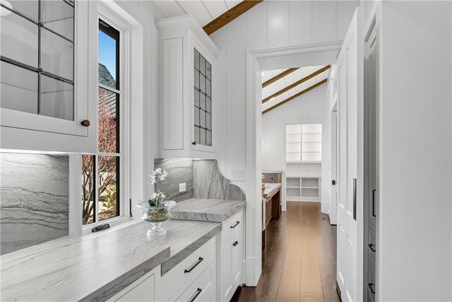 a kitchen with a refrigerator and a sink