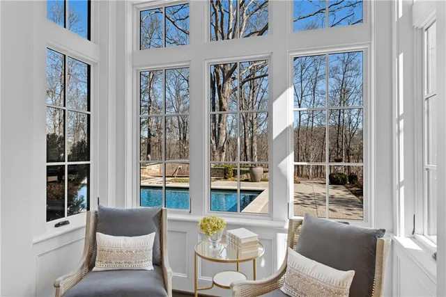 a view of a hallway with chandelier