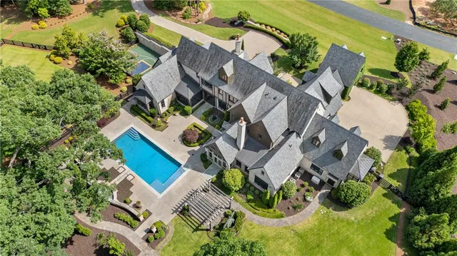 an aerial view of a house with a garden