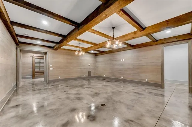 a view of swimming pool with outdoor seating and house in the background