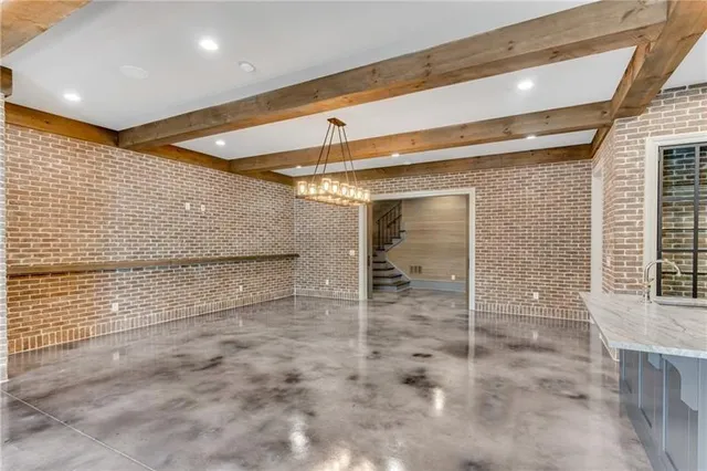 a view of a patio with table and chairs potted plants with wooden floor and fence
