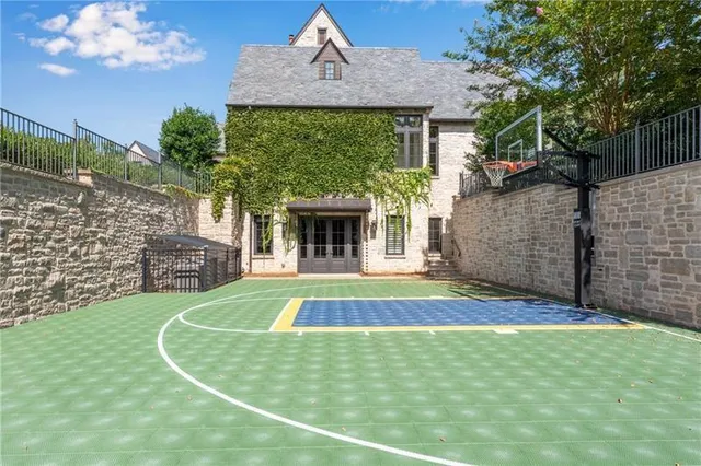 a front view of a house with a garden and plants