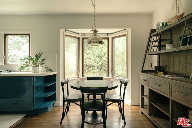 a view of a hallway with a wooden floor