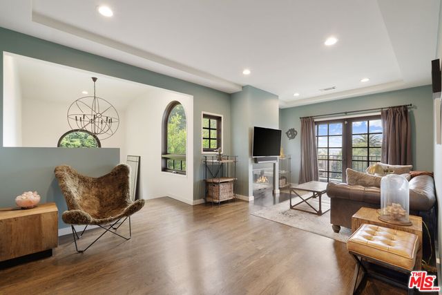 a dining hall with a dining table and chairs with wooden floor
