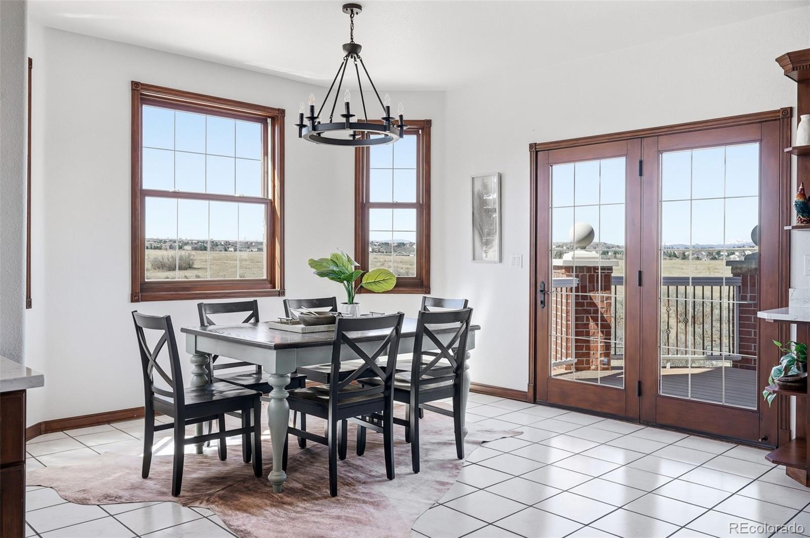4347 Crowfoot Valley Road Castle Rock, CO 80108 - Photo 12 of 50 a view of a dining room with furniture window and outside view