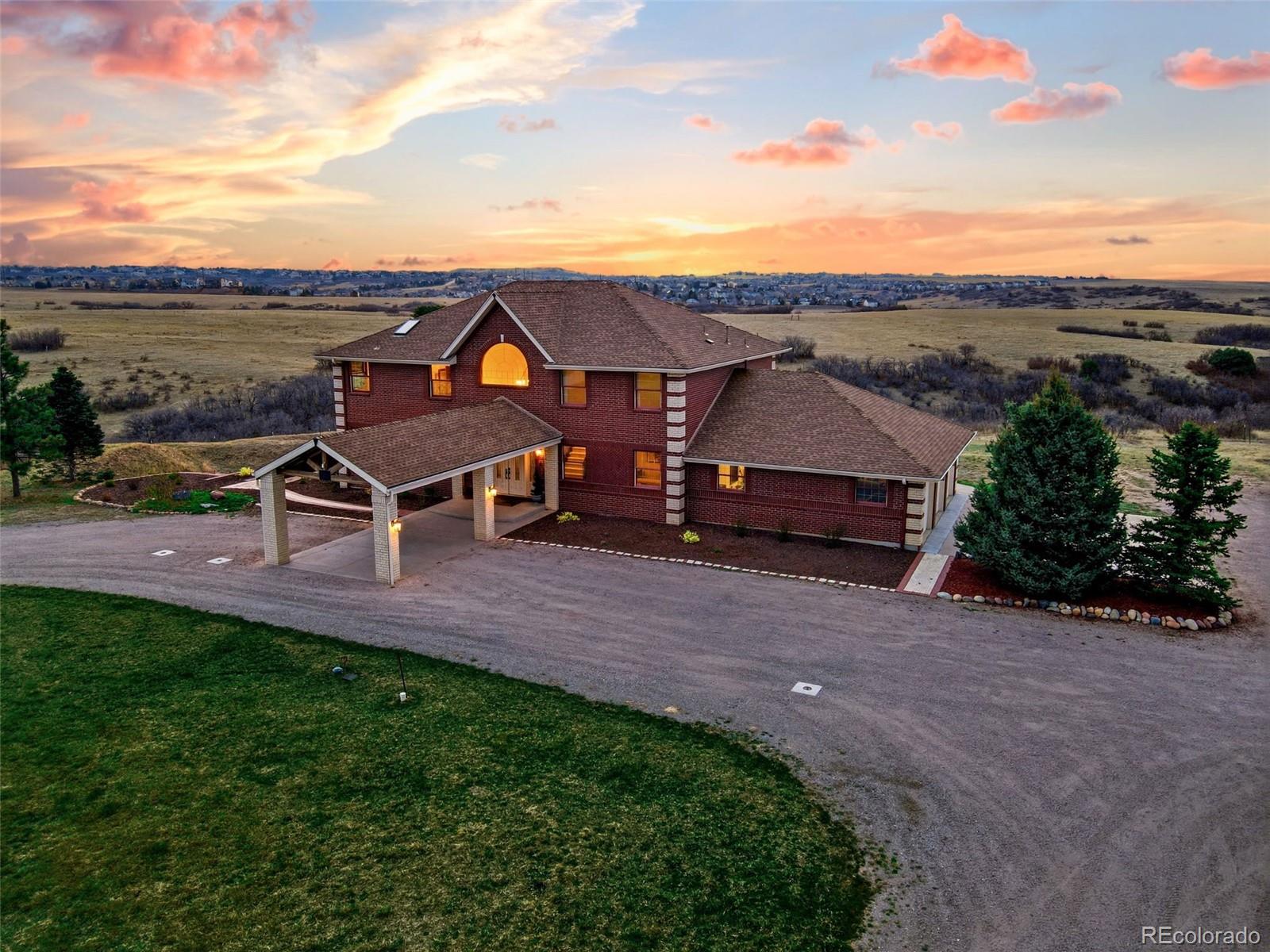 4347 Crowfoot Valley Road Castle Rock, CO 80108 - Photo 2 of 50 an aerial view of a house with a yard