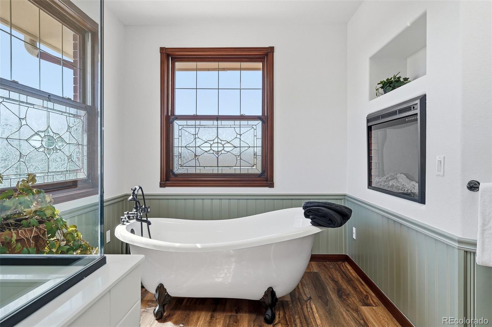 4347 Crowfoot Valley Road Castle Rock, CO 80108 - Photo 21 of 50 a white bath tub sitting next to a window