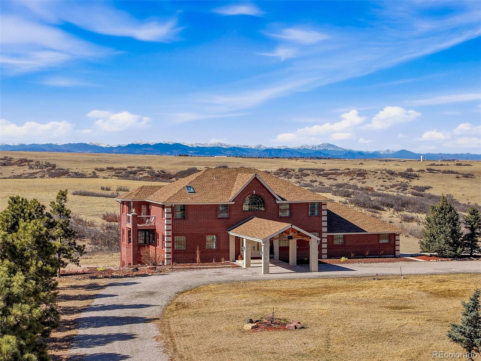 4347 Crowfoot Valley Road Castle Rock, CO 80108 - Photo 3 of 50 a view of a house with a ocean view