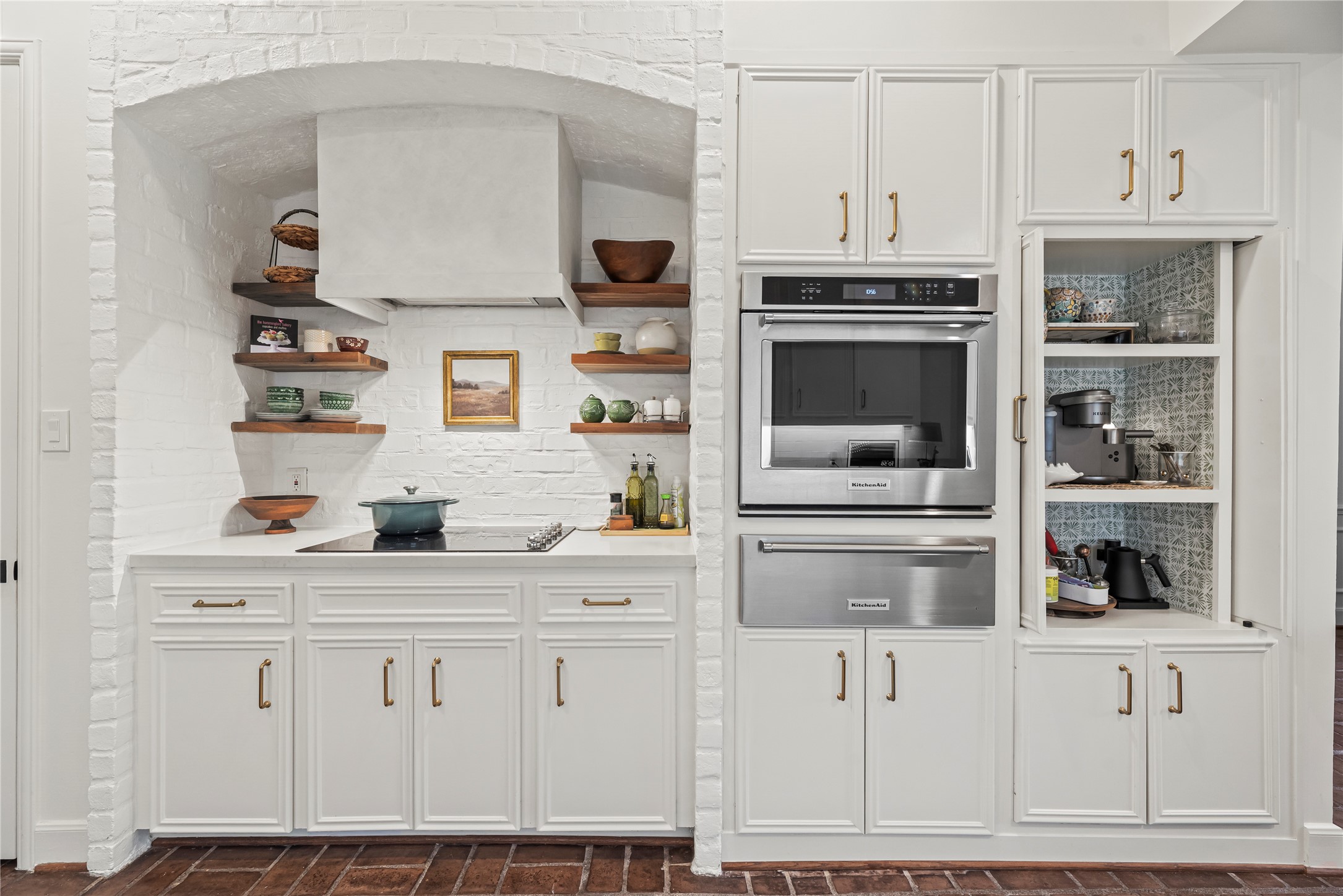 987 South Post Oak Lane Houston, TX 77056 - Photo 11 of 46 a kitchen with stainless steel appliances a stove and cabinets