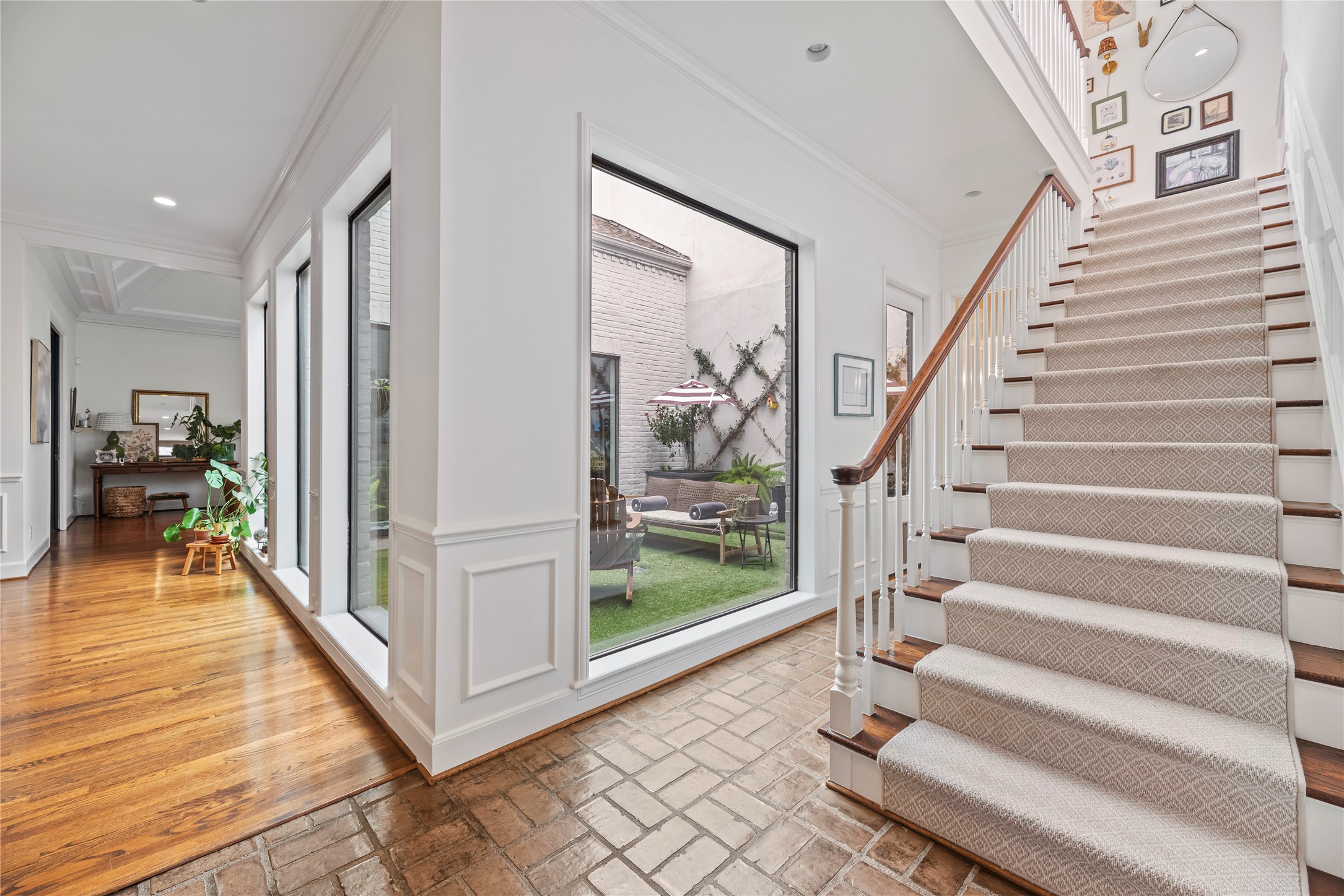 987 South Post Oak Lane Houston, TX 77056 - Photo 23 of 46 a view of entryway and hall with wooden floor