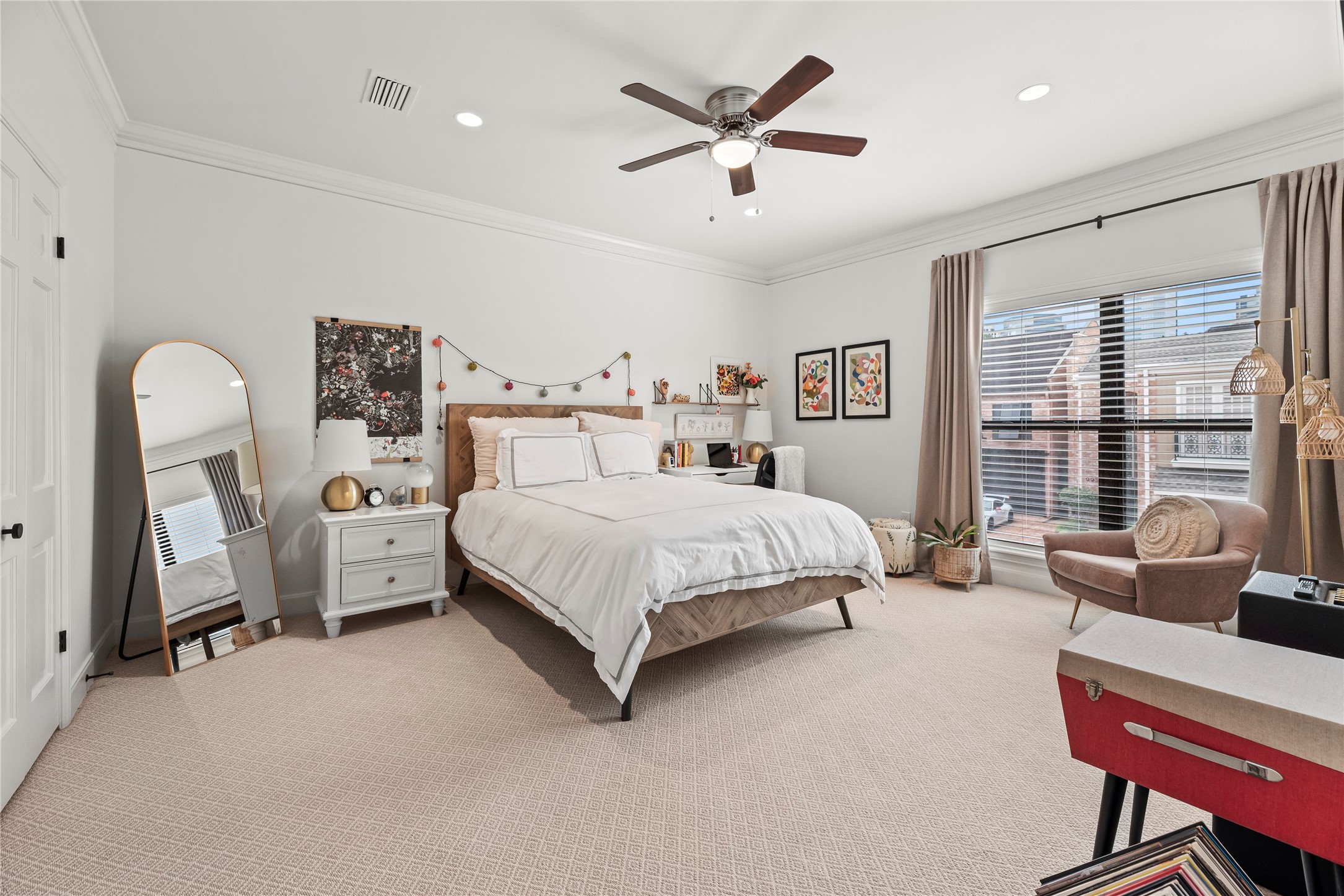 987 South Post Oak Lane Houston, TX 77056 - Photo 30 of 46 a bedroom with a bed a large window and couch
