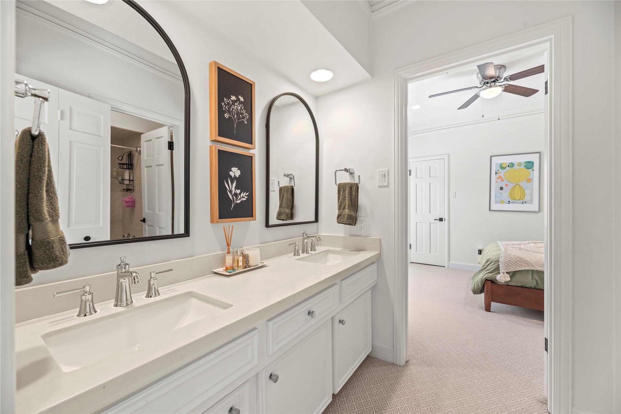 987 South Post Oak Lane Houston, TX 77056 - Photo 31 of 46 a en suite bathroom with double vanity sinks and a mirror