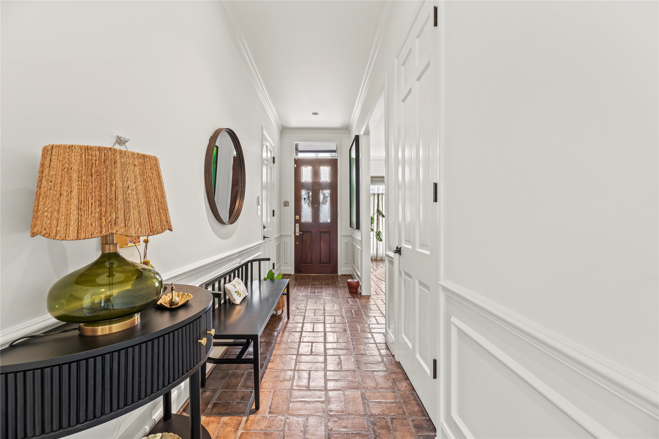 987 South Post Oak Lane Houston, TX 77056 - Photo 6 of 46 a view of a hallway with paintings on the wall