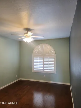 a view of living room with furniture and a fireplace