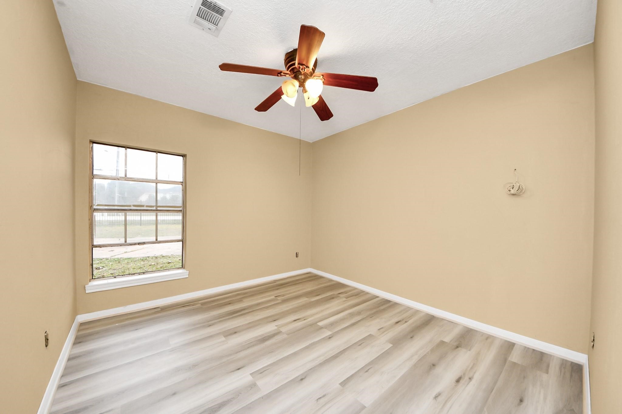 13610 Furman Road Houston, TX 77047 - Photo 15 of 25 an empty room with a window