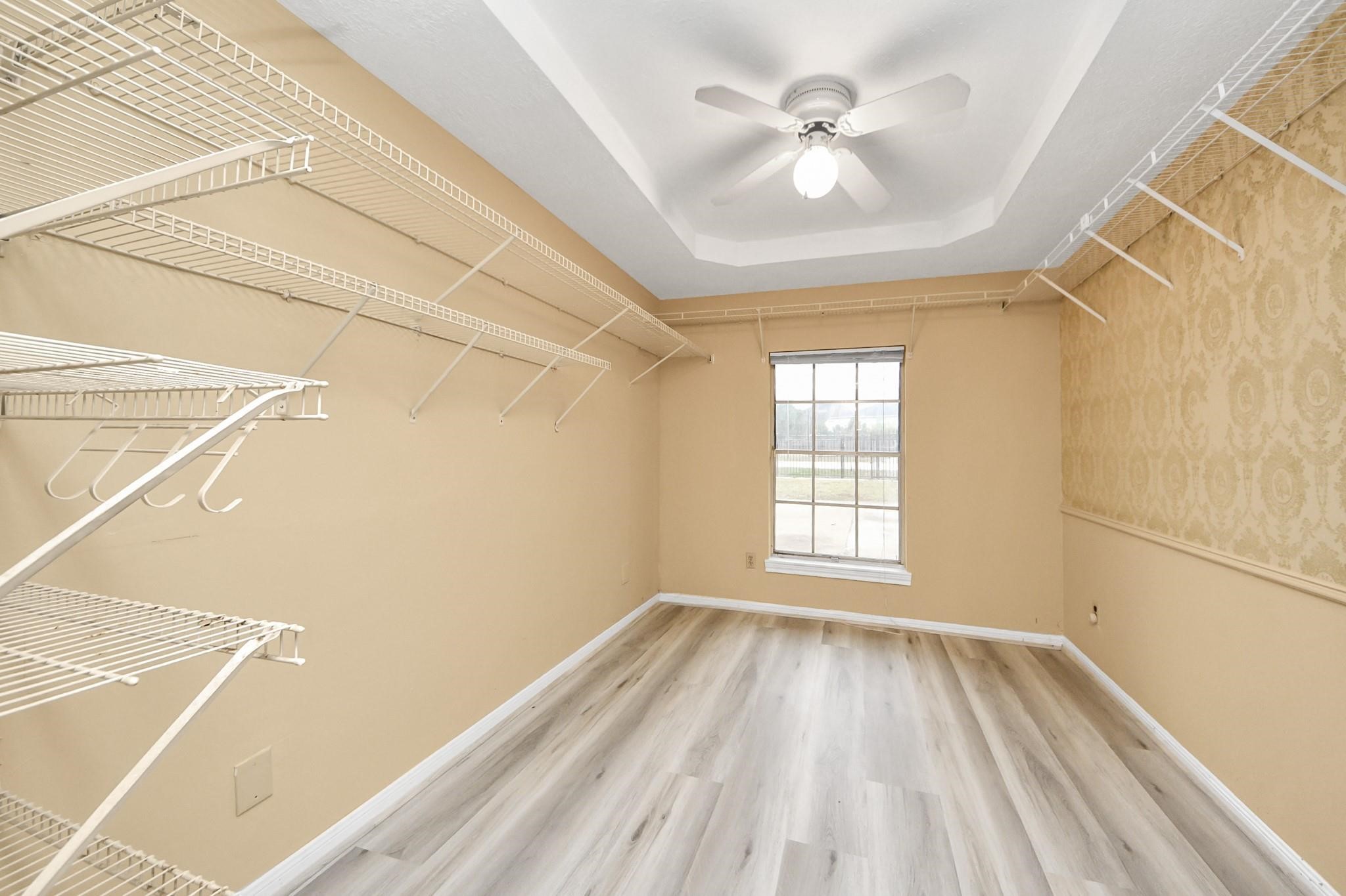 13610 Furman Road Houston, TX 77047 - Photo 16 of 25 a view of a room with a ceiling fan and a window