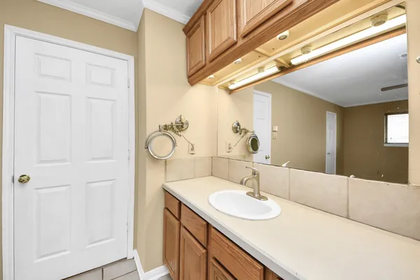 a bathroom with a sink and a mirror