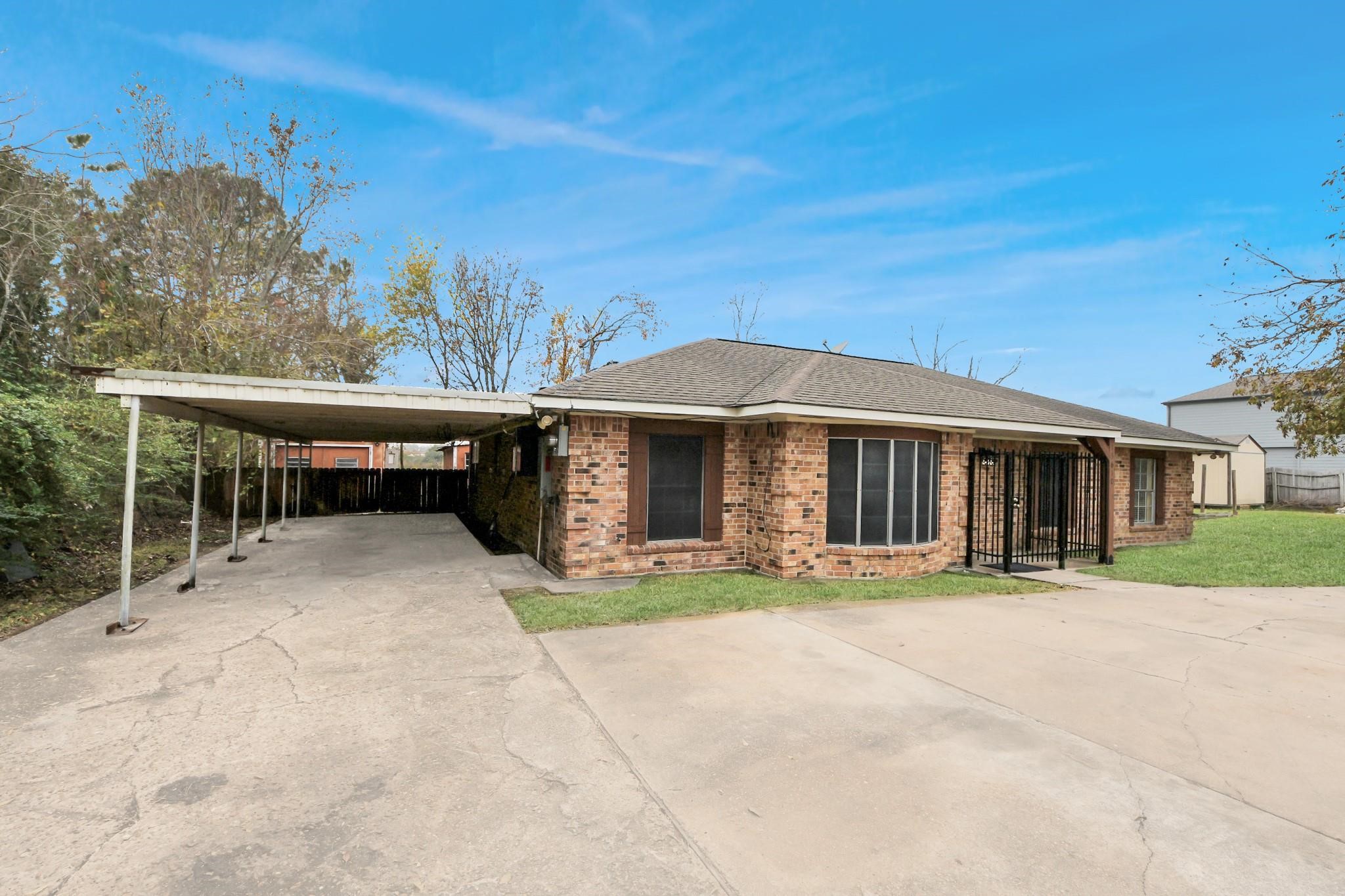 13610 Furman Road Houston, TX 77047 - Photo 2 of 25 a front view of a house with a garden