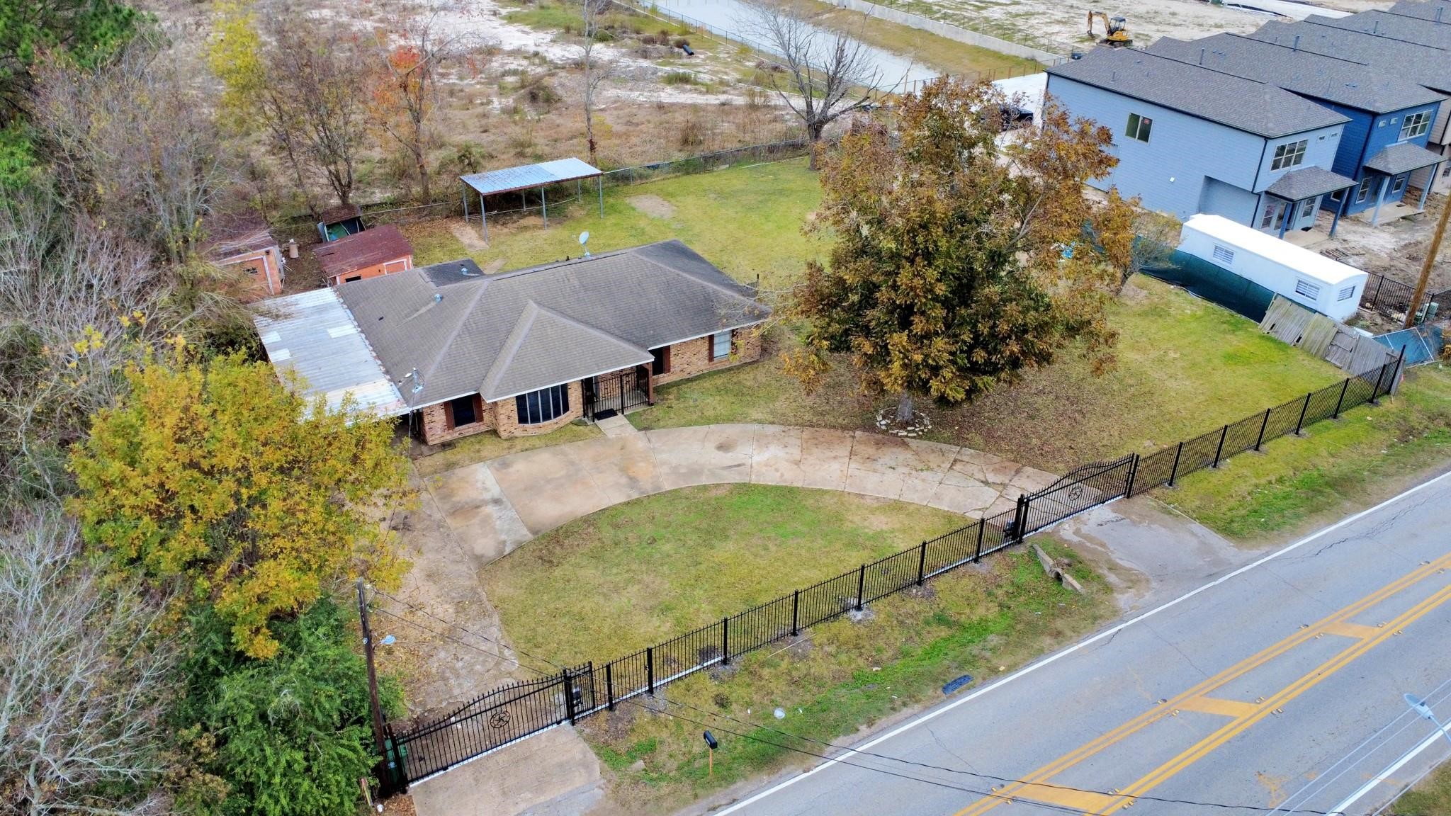 13610 Furman Road Houston, TX 77047 - Photo 22 of 25 a view of a swimming pool with a yard and plants