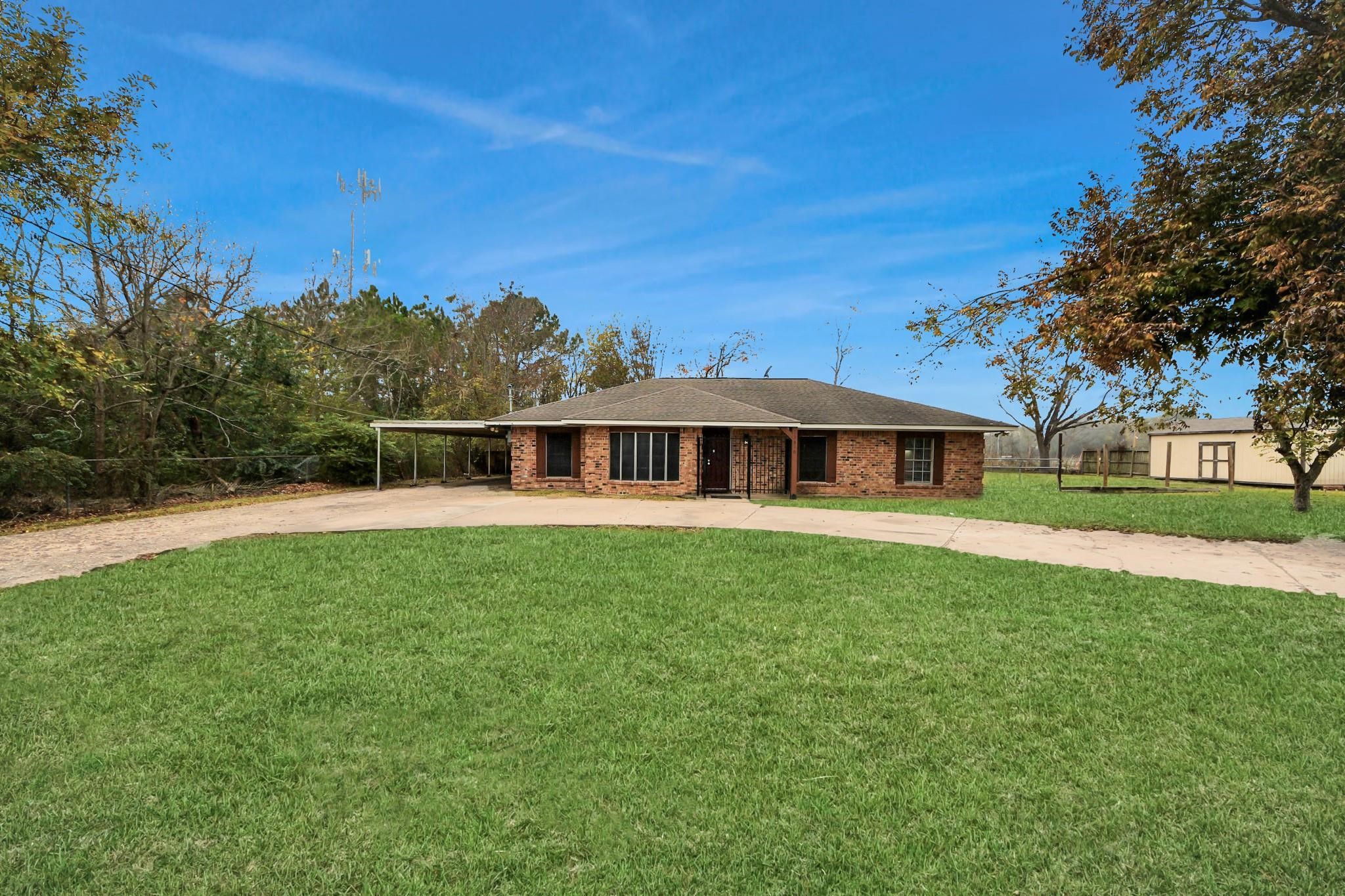 13610 Furman Road Houston, TX 77047 - Photo 3 of 25 a front view of a house with a garden