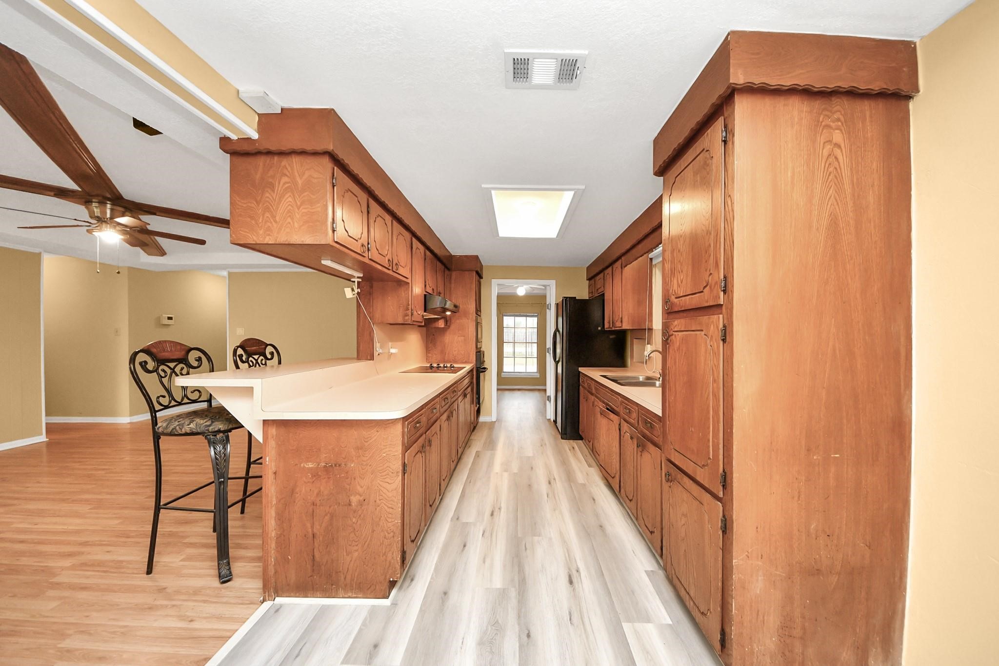 13610 Furman Road Houston, TX 77047 - Photo 9 of 25 a view of a kitchen cabinets and a stove