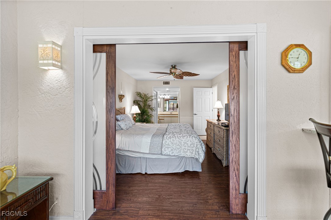 5905 Trailwinds Drive, Unit 824 Fort Myers, FL 33907 - Photo 13 of 50 a living room with furniture and a table