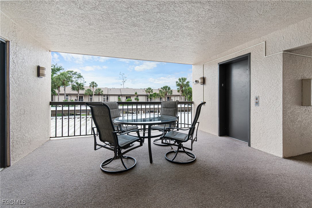 5905 Trailwinds Drive, Unit 824 Fort Myers, FL 33907 - Photo 3 of 50 a view of a dining room with furniture window and outside view