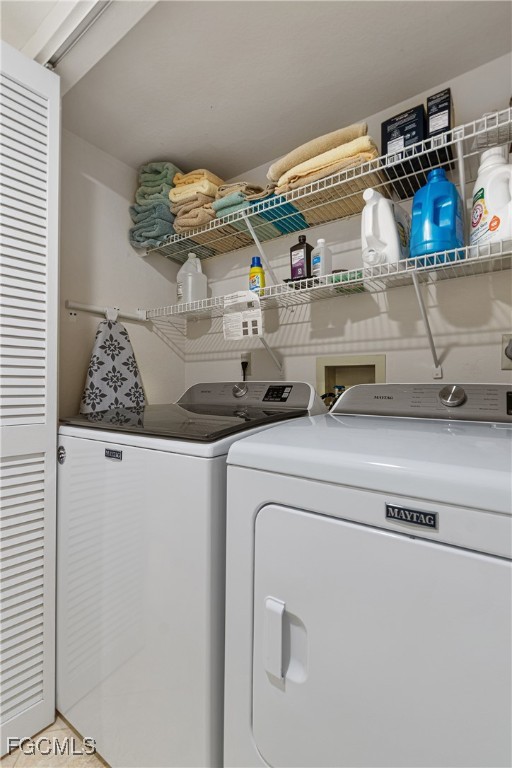 5905 Trailwinds Drive, Unit 824 Fort Myers, FL 33907 - Photo 37 of 50 a utility room with dryer and washer