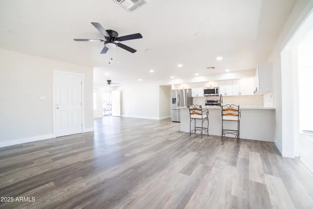 a view of kitchen with wooden floor and window
