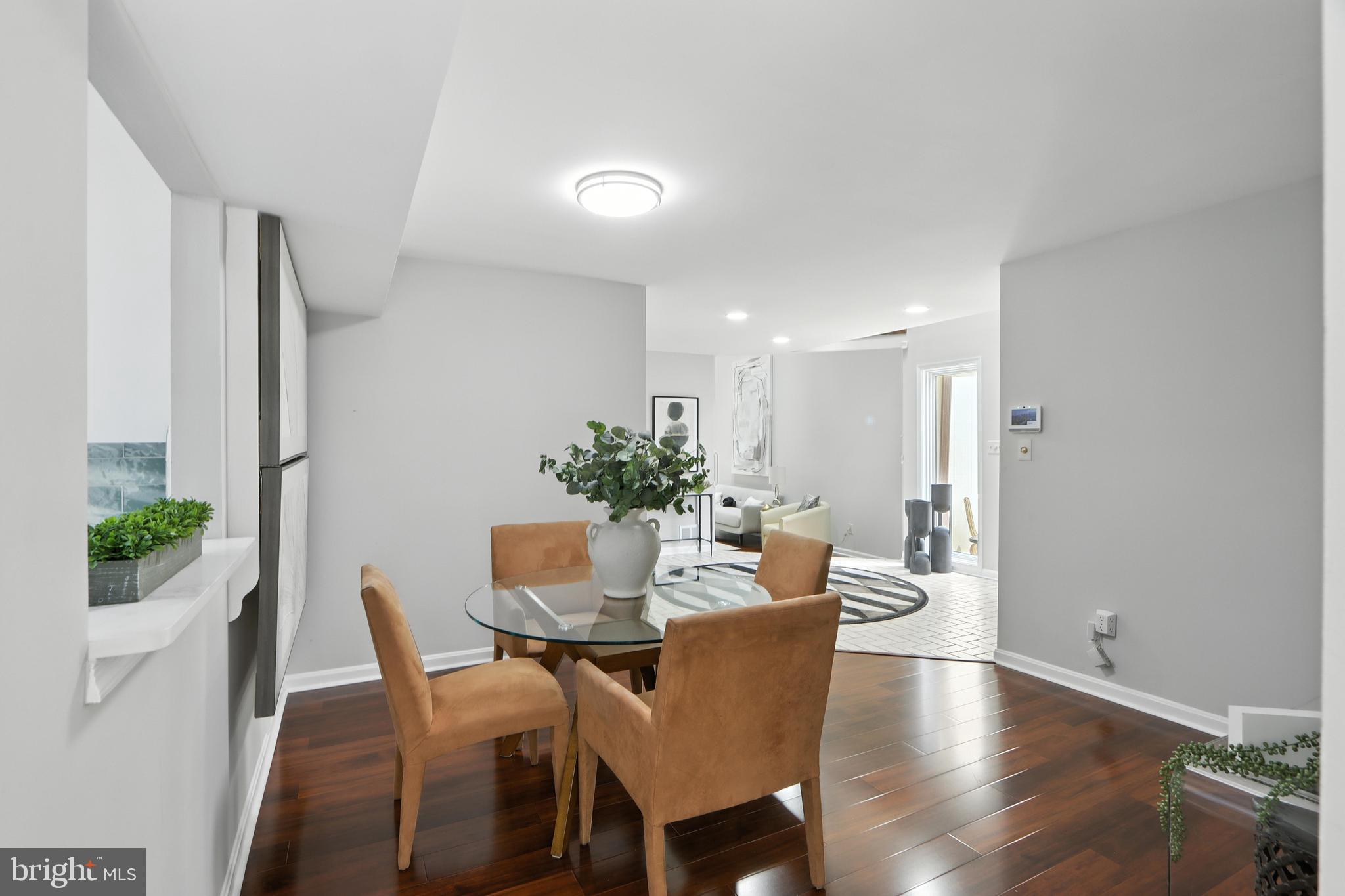 3005 Courtside Road Bowie, MD 20721 - Photo 16 of 43 a dining room with furniture and wooden floor