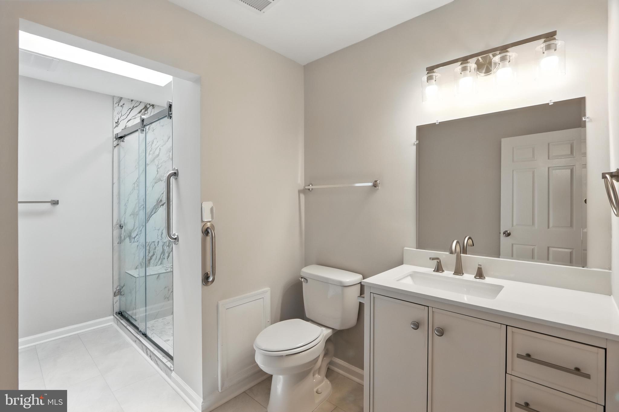 3005 Courtside Road Bowie, MD 20721 - Photo 27 of 43 a bathroom with a sink toilet and shower