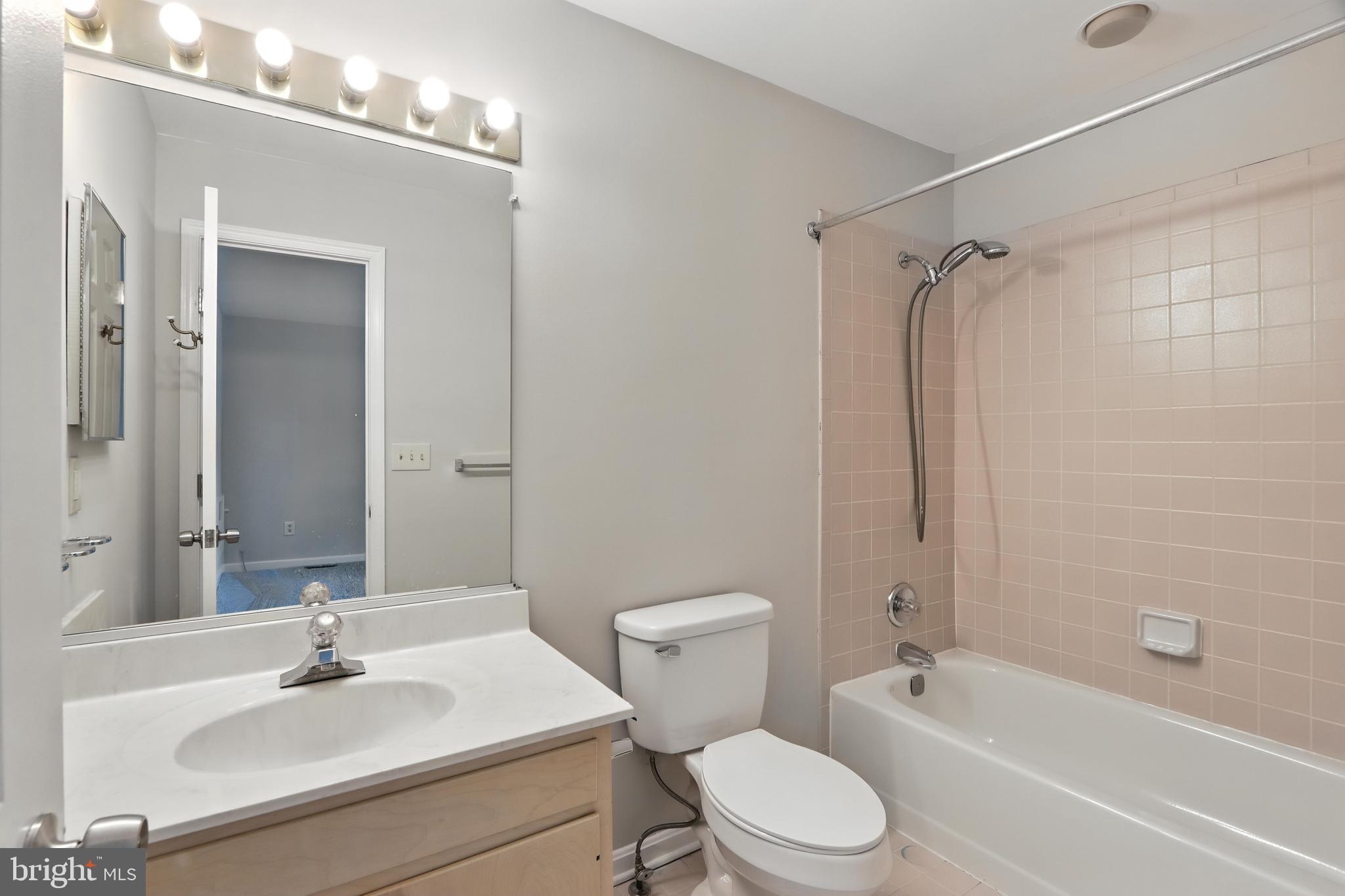 3005 Courtside Road Bowie, MD 20721 - Photo 32 of 43 a bathroom with a sink toilet and shower