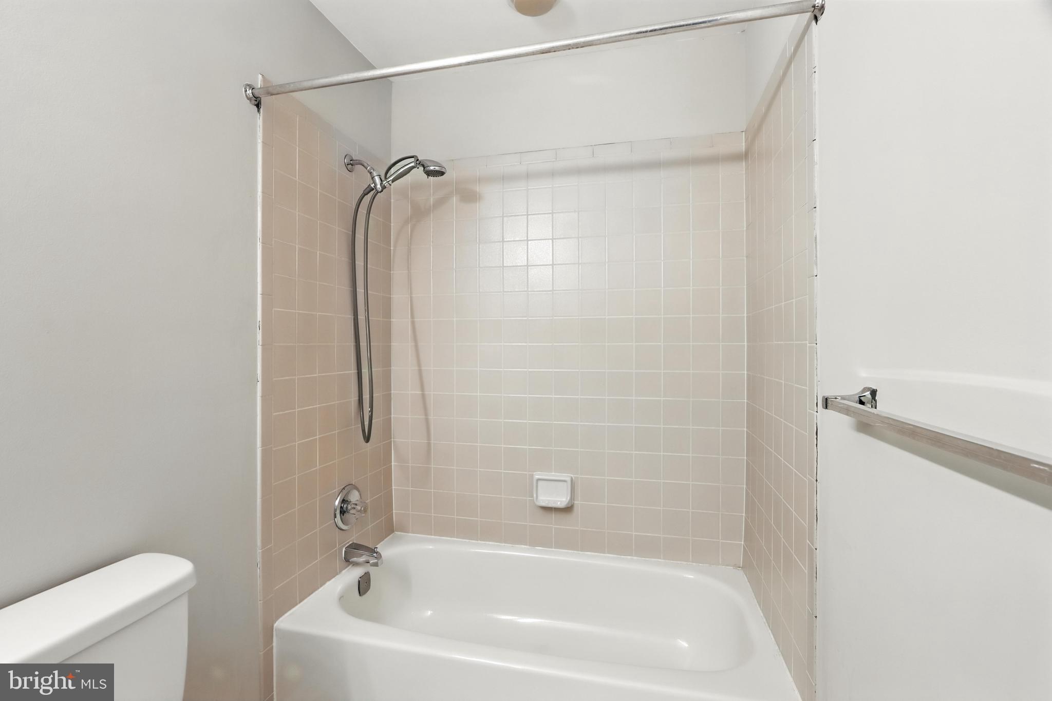 3005 Courtside Road Bowie, MD 20721 - Photo 33 of 43 a bathroom with a tub and a shower