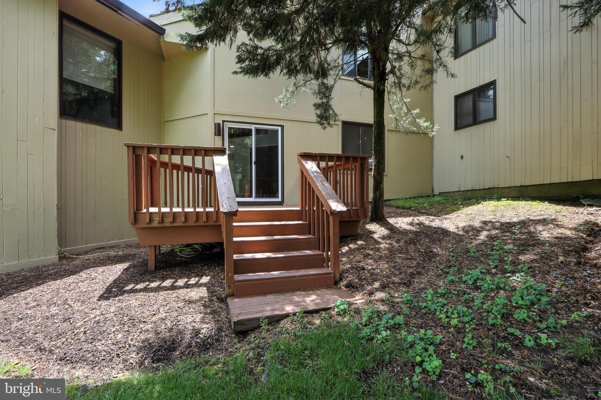 3005 Courtside Road Bowie, MD 20721 - Photo 35 of 43 a backyard of a house with barbeque oven and outdoor seating