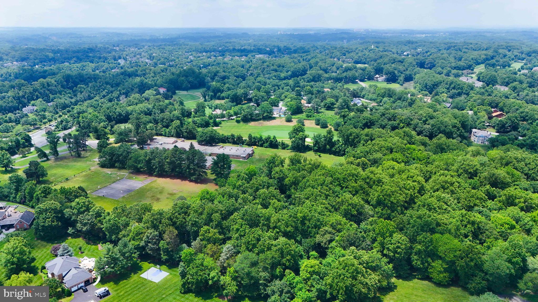3005 Courtside Road Bowie, MD 20721 - Photo 40 of 43 a view of a garden with a building in the background