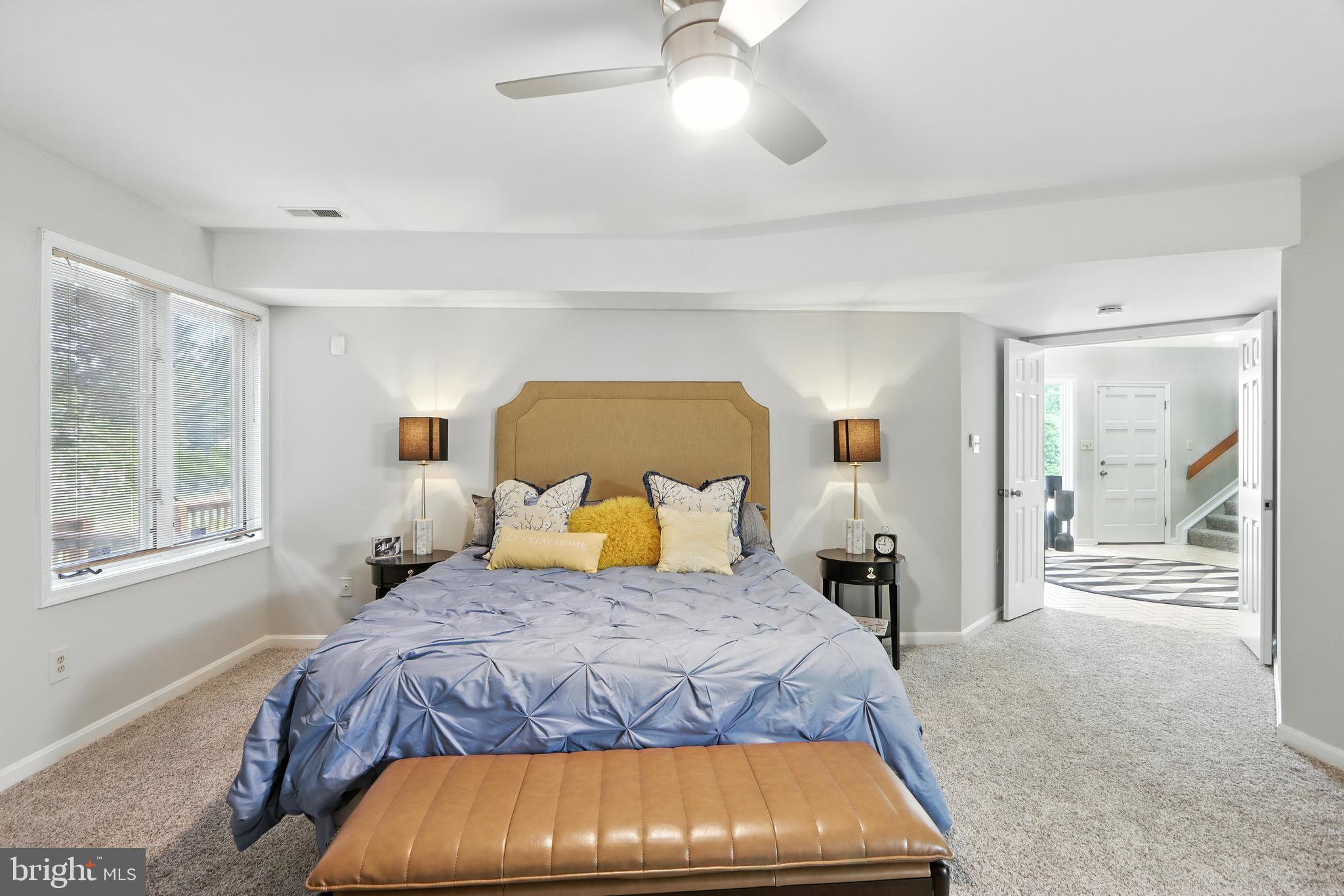 3005 Courtside Road Bowie, MD 20721 - Photo 10 of 43 a bedroom with a large bed and a window