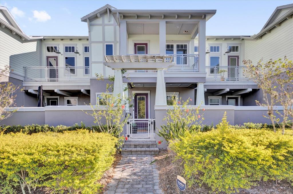 9219 Laureate Boulevard Orlando, FL 32827 - Photo 1 of 1 a front view of a house with a fountain in a patio