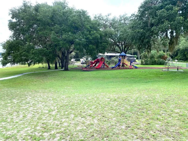 a childrens park with lots of swings and slides