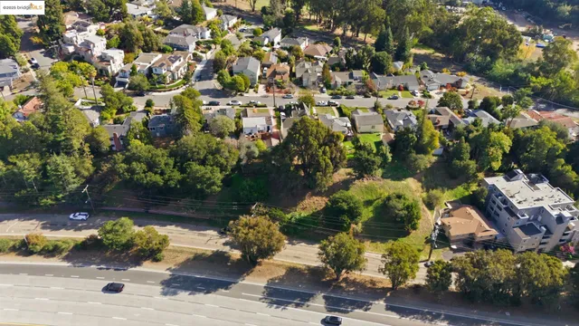 an aerial view of a houses with yard