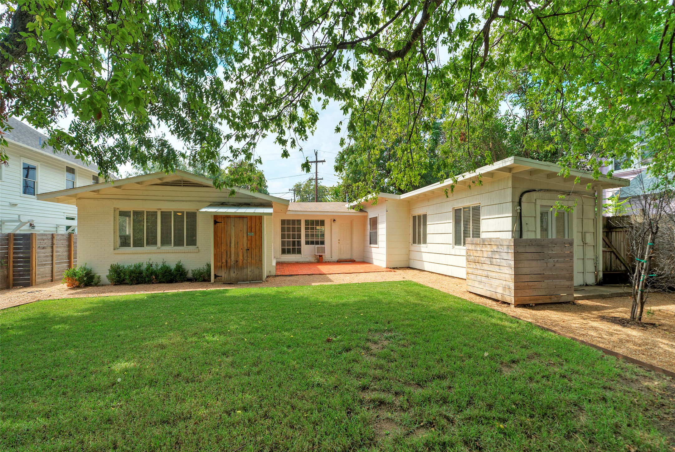 1803 Pearl Street Austin, TX 78701 - Photo 2 of 33 a front view of a house with a garden